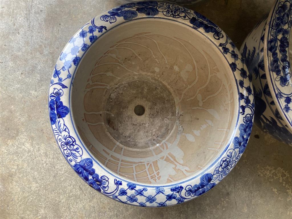 A graduated set of six Chinese style blue and white circular planters, largest width 70cm, height 50cm